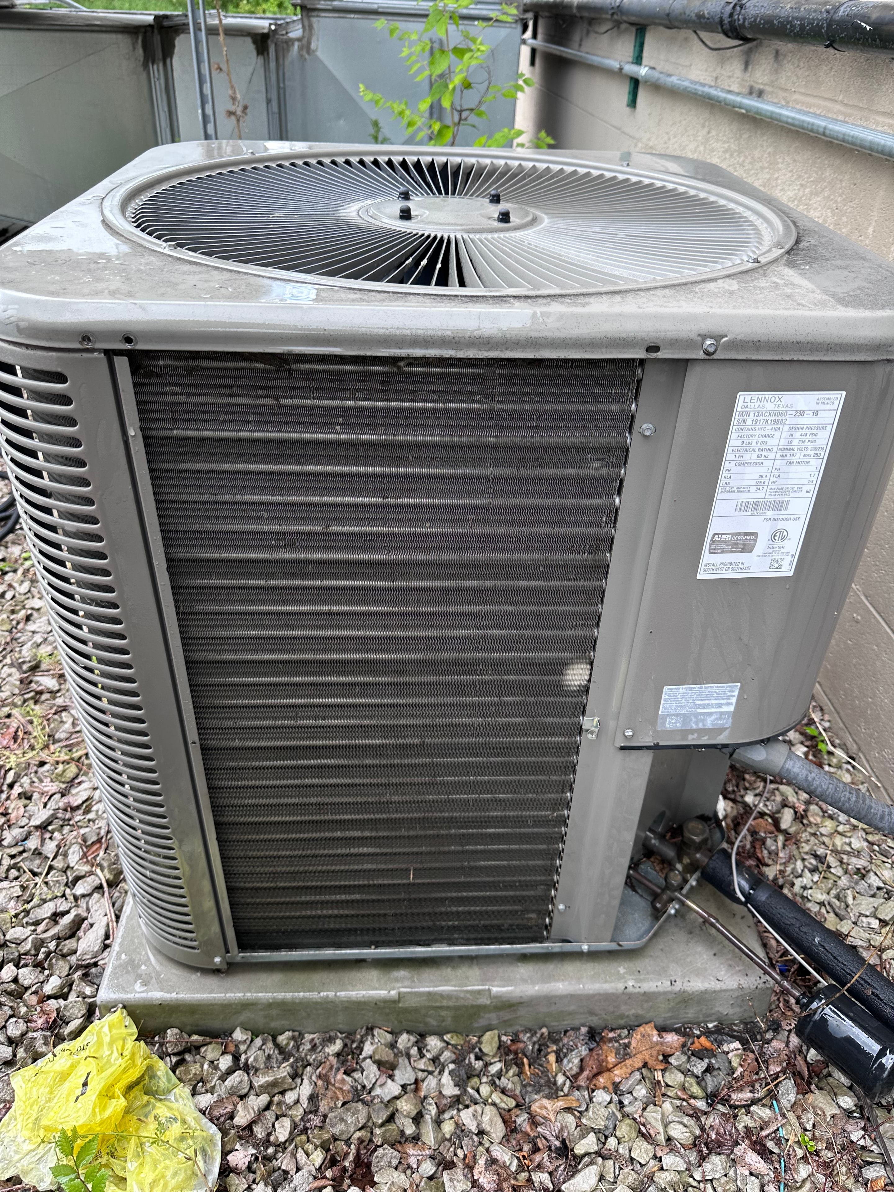 Lennox air conditioning condenser unit serviced by HomeFlow for a Chelsea, Michigan customer